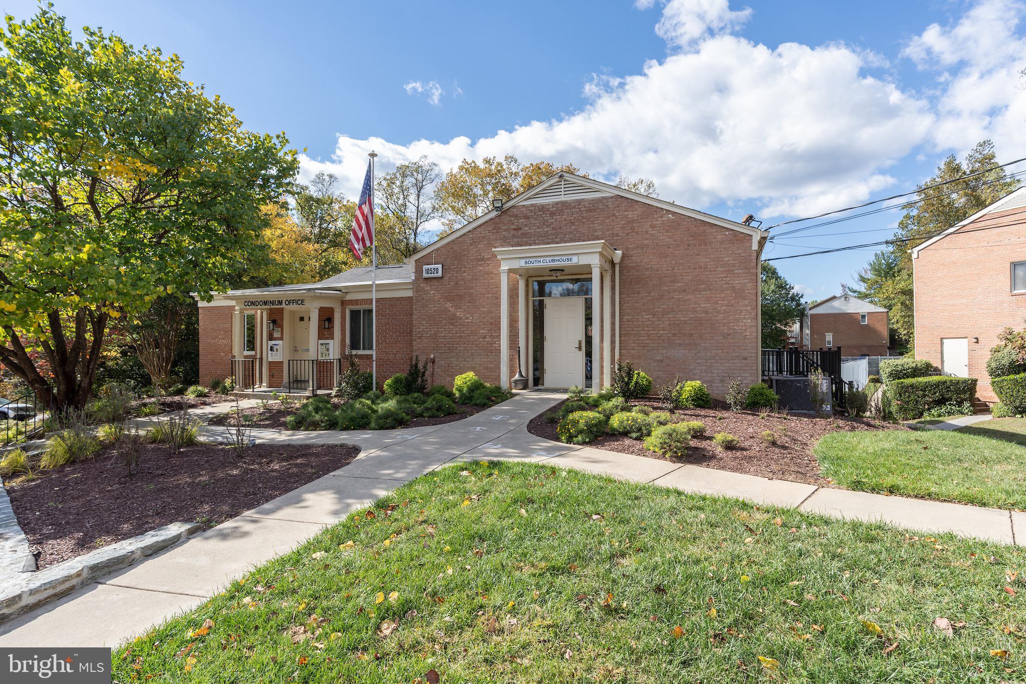 10423 Montrose Avenue, Unit 10423 Bethesda, MD 20814 - Photo 18 of 22 a front view of a house with a yard