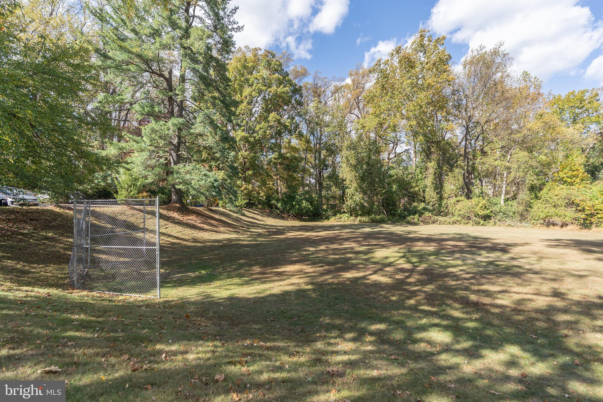 10423 Montrose Avenue, Unit 10423 Bethesda, MD 20814 - Photo 21 of 22 a view of a yard with large trees