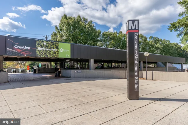 a view of a street with sitting area