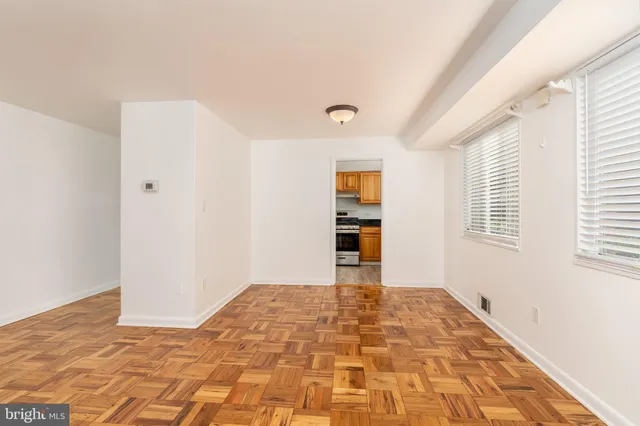 a view of an empty room with a window