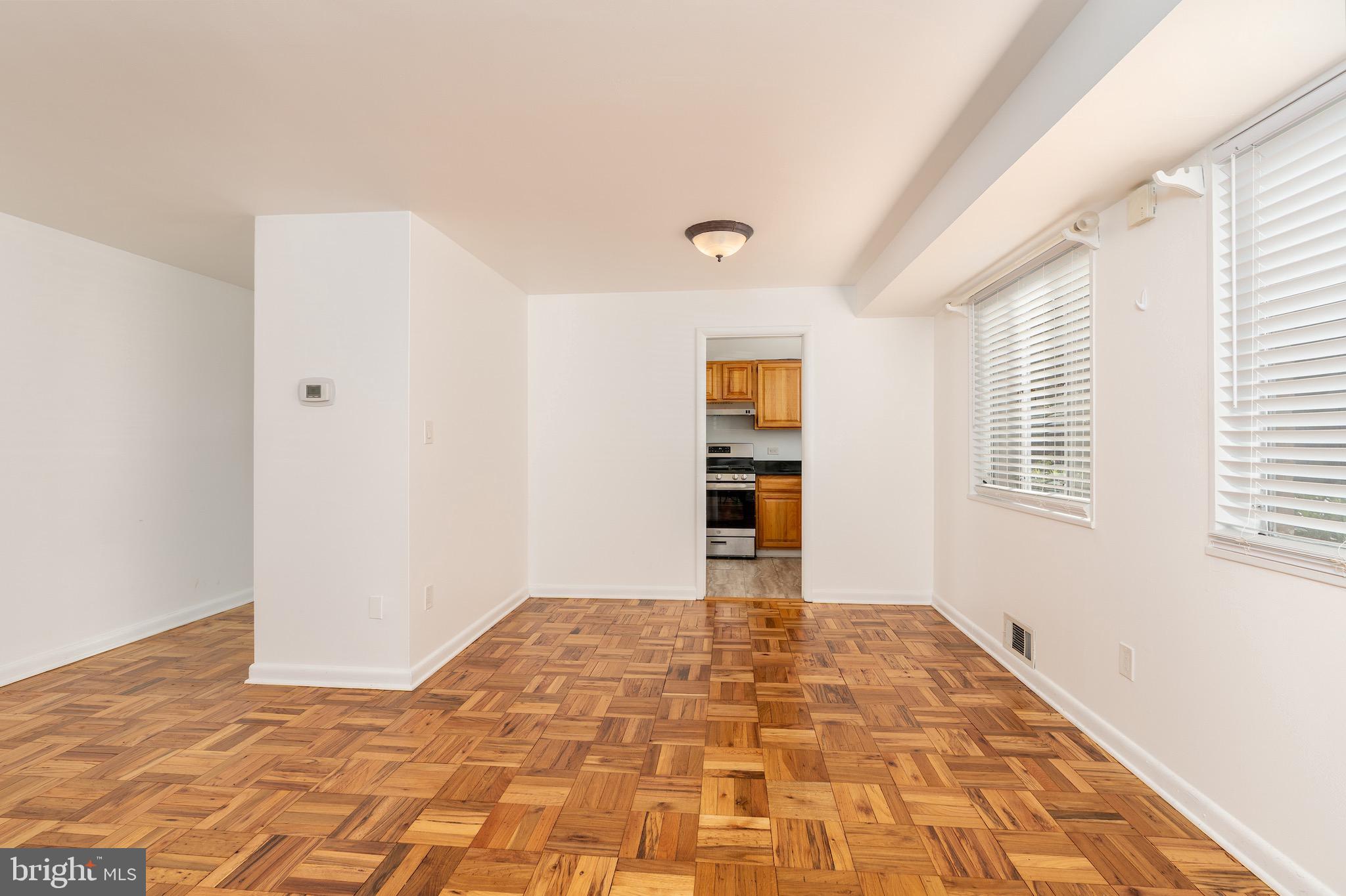 10423 Montrose Avenue, Unit 10423 Bethesda, MD 20814 - Photo 8 of 22 a view of an empty room with a window