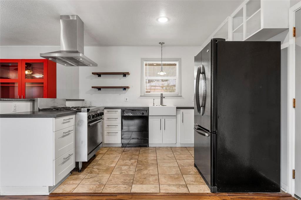 2208 Lake Forest Drive Waco, TX 76708 - Photo 11 of 28 a kitchen with stainless steel appliances granite countertop a refrigerator stove and sink