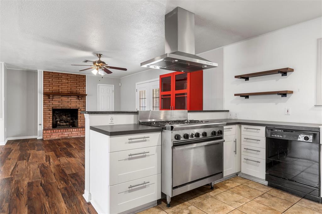 2208 Lake Forest Drive Waco, TX 76708 - Photo 12 of 28 a kitchen with stainless steel appliances granite countertop a stove and a sink