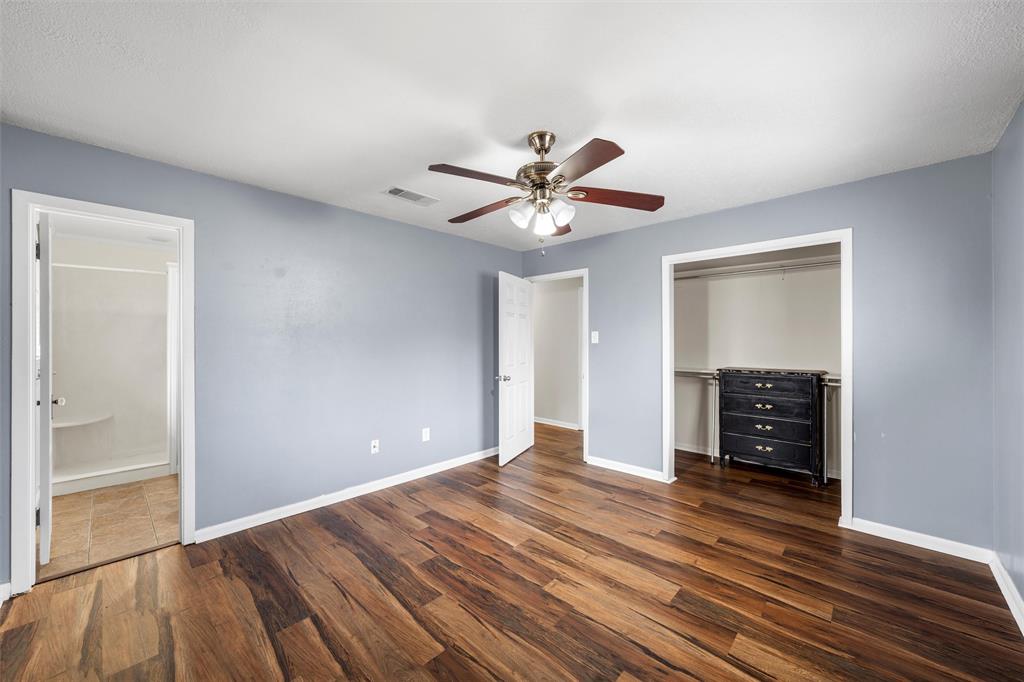 2208 Lake Forest Drive Waco, TX 76708 - Photo 21 of 28 wooden floor in an empty room with a window