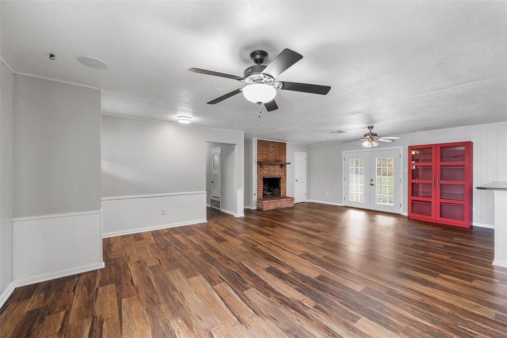2208 Lake Forest Drive Waco, TX 76708 - Photo 7 of 28 a view of an empty room with window and wooden floor
