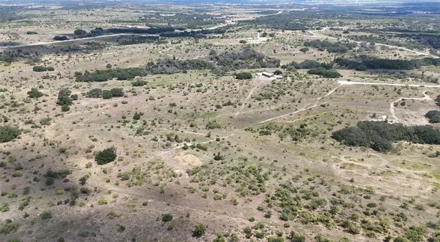 a view of a dry yard with wooden floor
