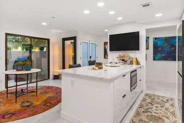 a outdoor dining space with furniture and flowers