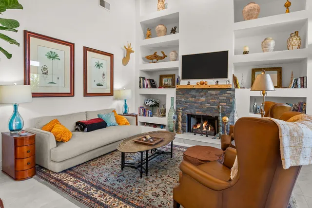 a living room with furniture flowerpot and a potted plant