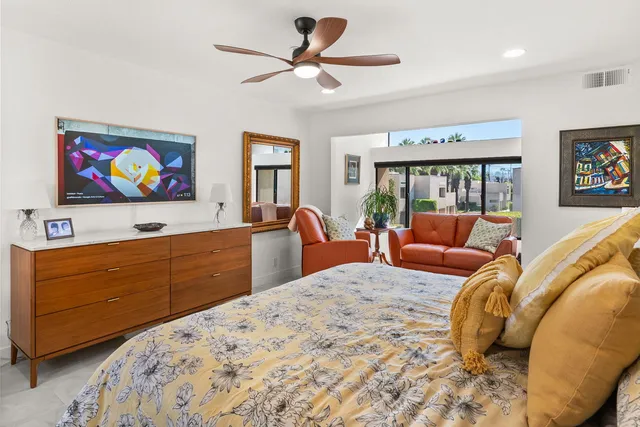 a bathroom with double vanity sinks a vanity a mirror and shower
