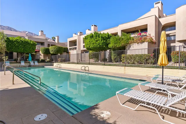 a view of a swimming pool with a patio