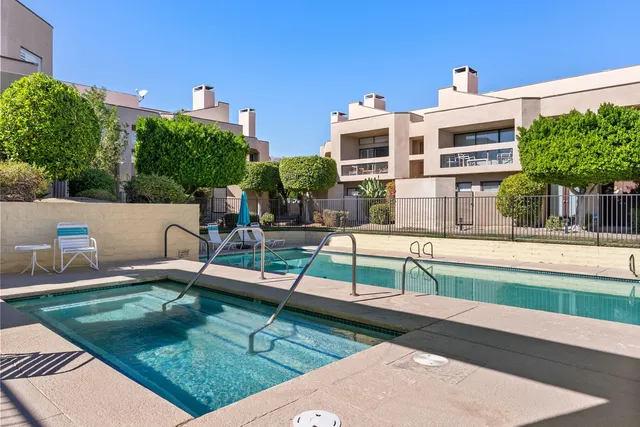 a view of a bench in front of a house