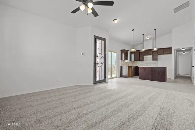 a view of a kitchen with a sink and cabinet area
