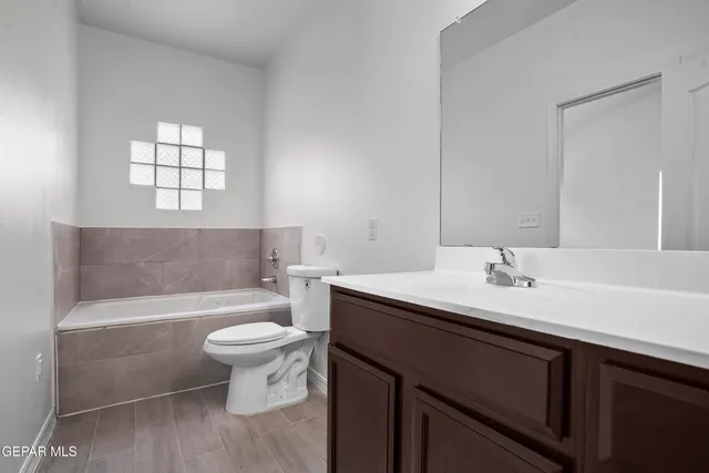 a bathroom with a sink a toilet and a bathtub