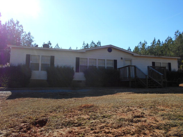 972 Old Indian Springs Road, Unit 4 Forsyth, GA 31029 - Photo 1 of 10 a house view with a garden space