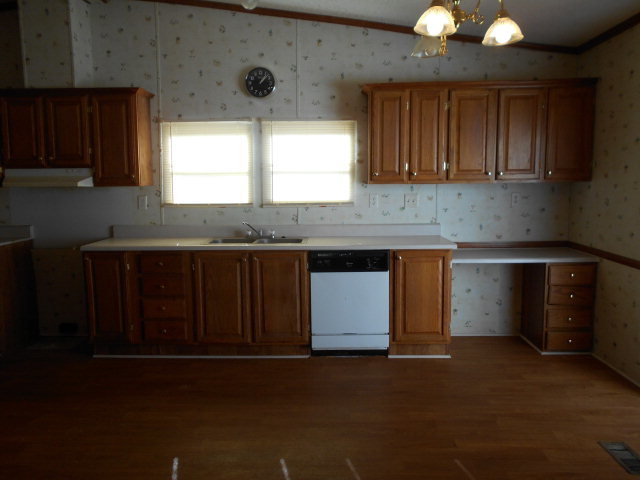 972 Old Indian Springs Road, Unit 4 Forsyth, GA 31029 - Photo 8 of 10 a kitchen with a cabinets and window