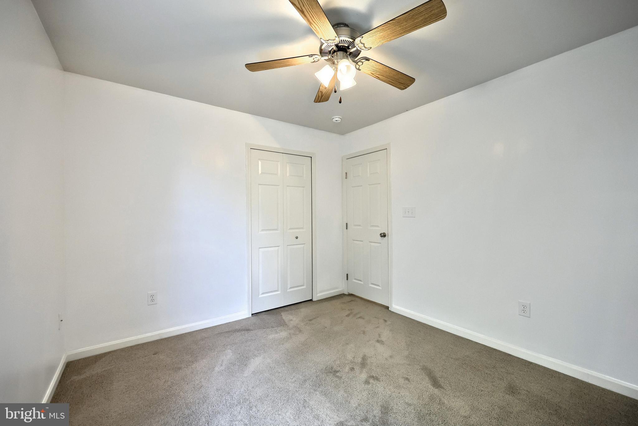 425 Lakeview Drive Spring Grove, PA 17362 - Photo 30 of 51 an empty room with a chandelier fan and windows