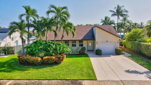 a front view of house with yard and outdoor seating