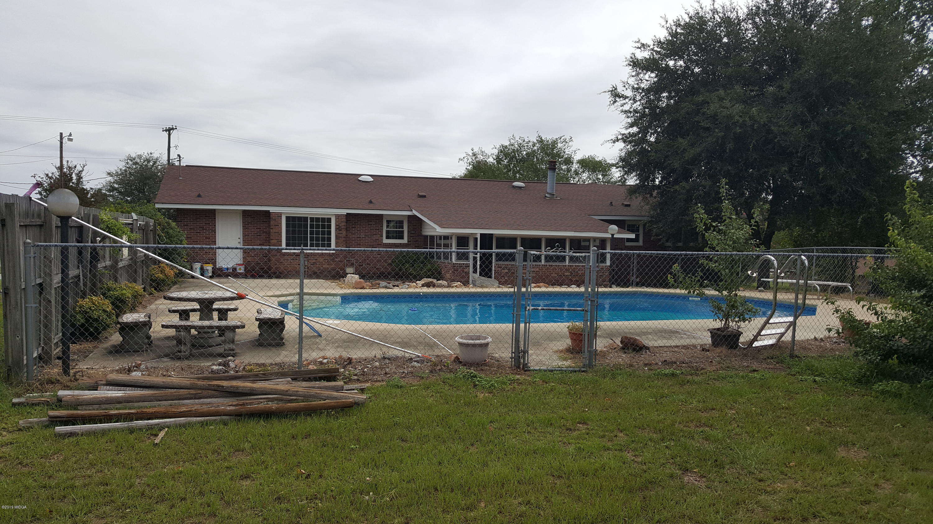 5545 Marshall Mill Road Lizella, GA 31052 - Photo 11 of 12 a view of house with a yard and sitting area