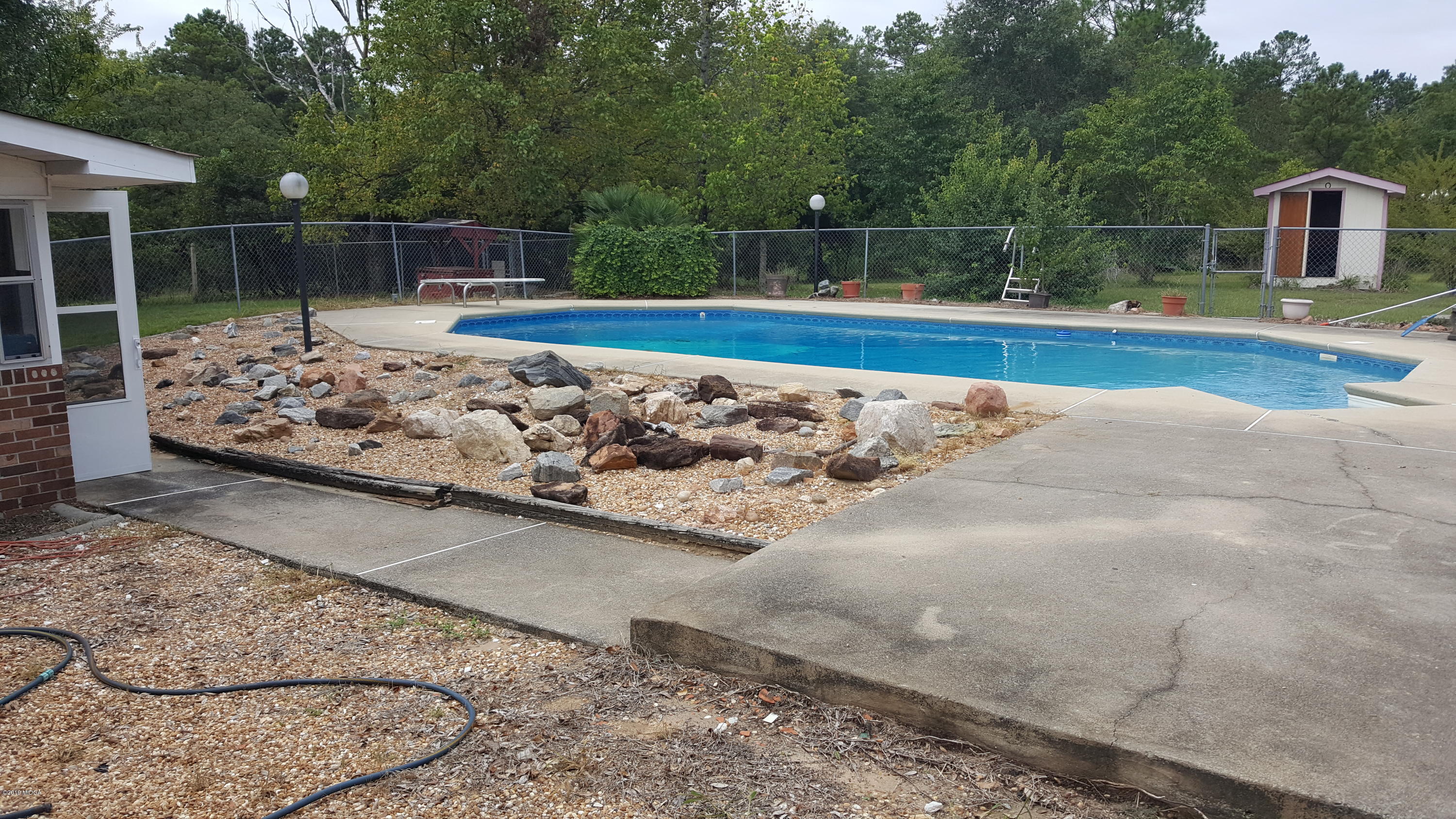 5545 Marshall Mill Road Lizella, GA 31052 - Photo 12 of 12 a view of a backyard with swimming pool
