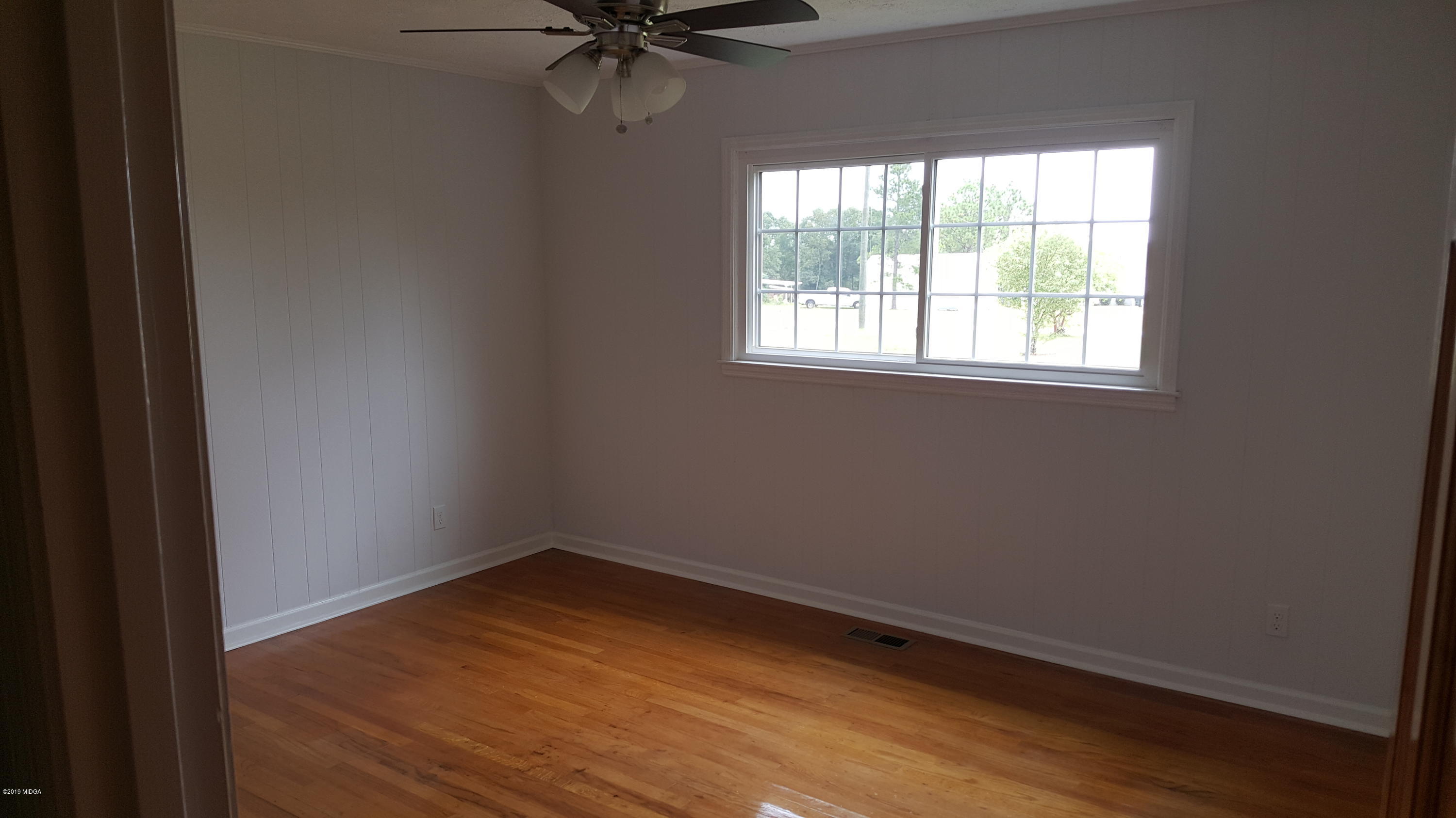5545 Marshall Mill Road Lizella, GA 31052 - Photo 6 of 12 an empty room with a window