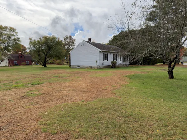 a view of a big yard with a house