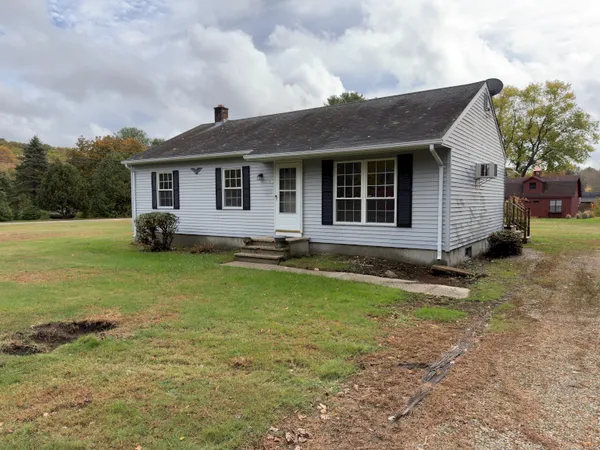a front view of a house with yard