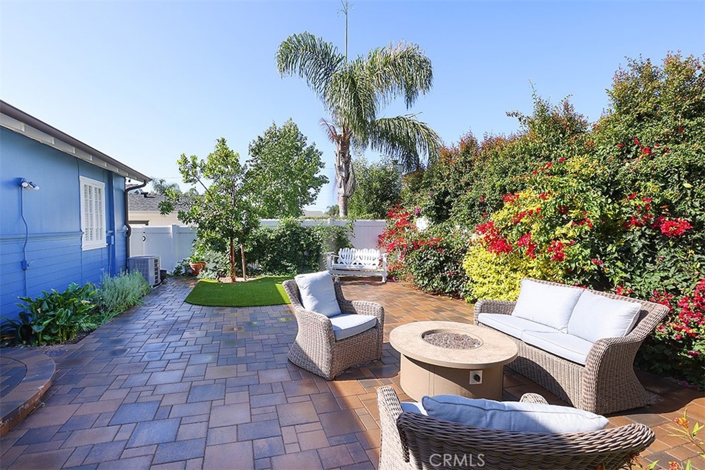 432 Shadow Lane Laguna Beach, CA 92651 - Photo 14 of 22 a view of a chairs and table in backyard