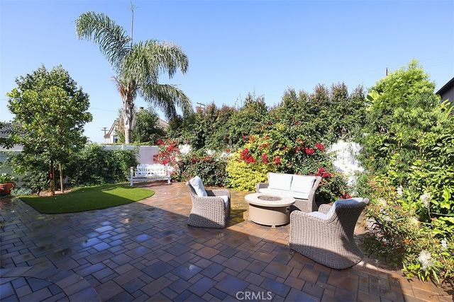 a view of a backyard with garden and plants