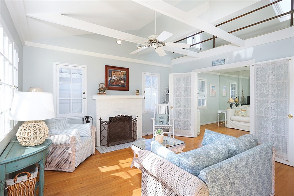 432 Shadow Lane Laguna Beach, CA 92651 - Photo 3 of 22 a living room with furniture a fireplace and a flat screen tv