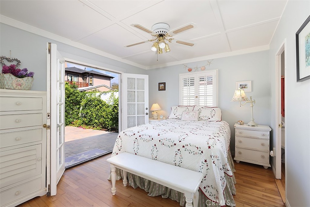 432 Shadow Lane Laguna Beach, CA 92651 - Photo 7 of 22 a bedroom with a bed and a chandelier