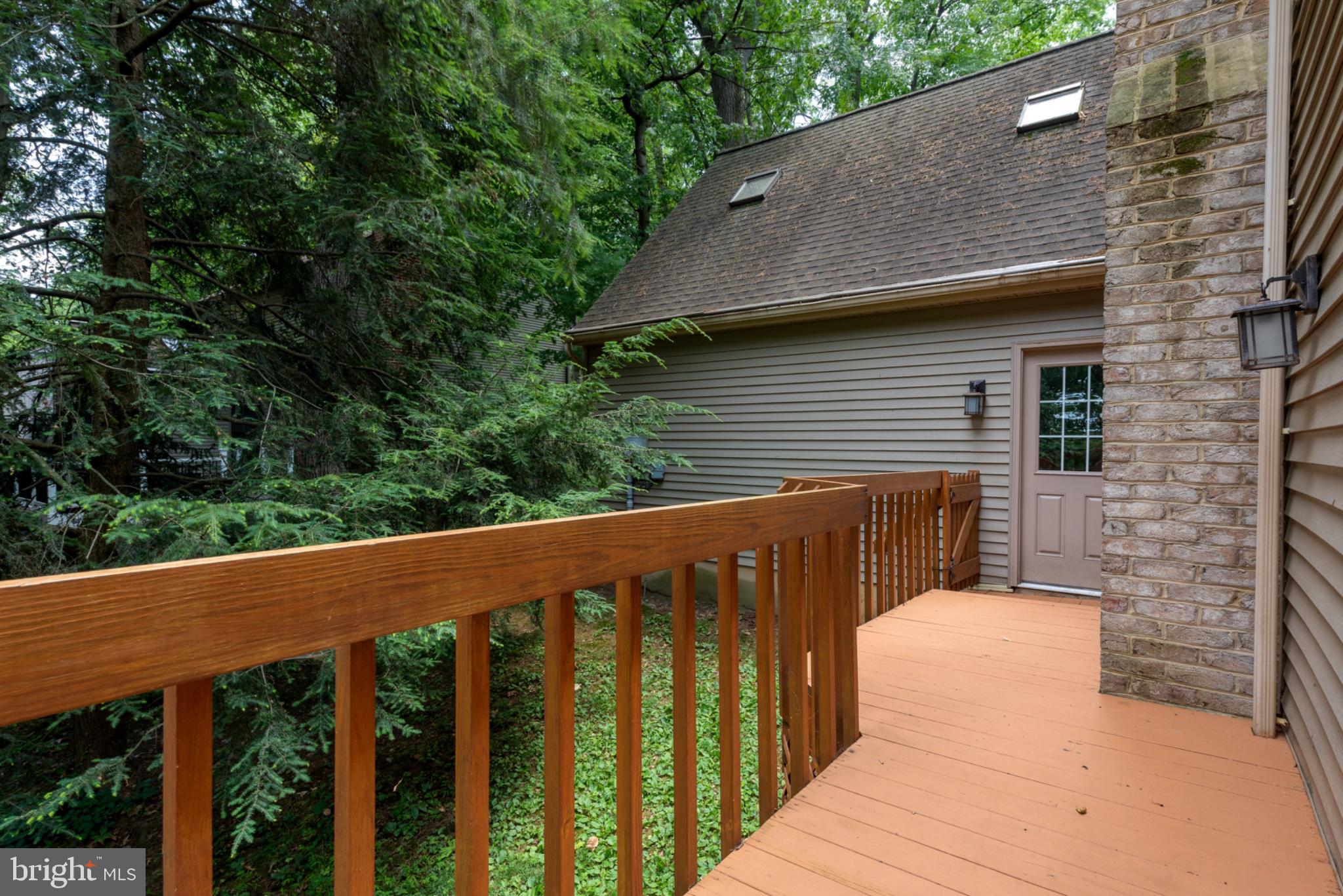 2861 Spring Valley Road Lancaster, PA 17601 - Photo 39 of 59 Serene deck nestled in lush greenery.