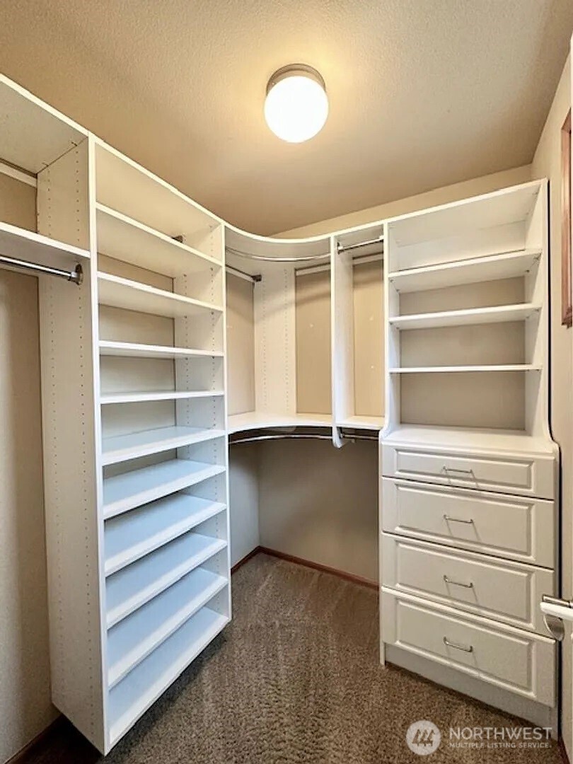 2013 Northeast 27th Street Renton, WA 98056 - Photo 13 of 25 a view of walk in closet with empty racks