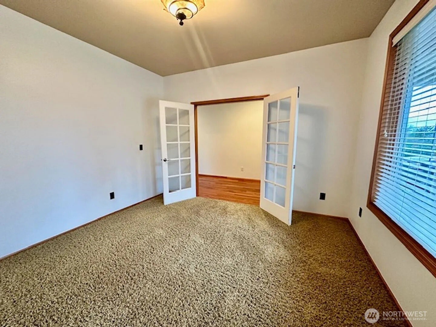 2013 Northeast 27th Street Renton, WA 98056 - Photo 2 of 25 a view of an empty room with a window