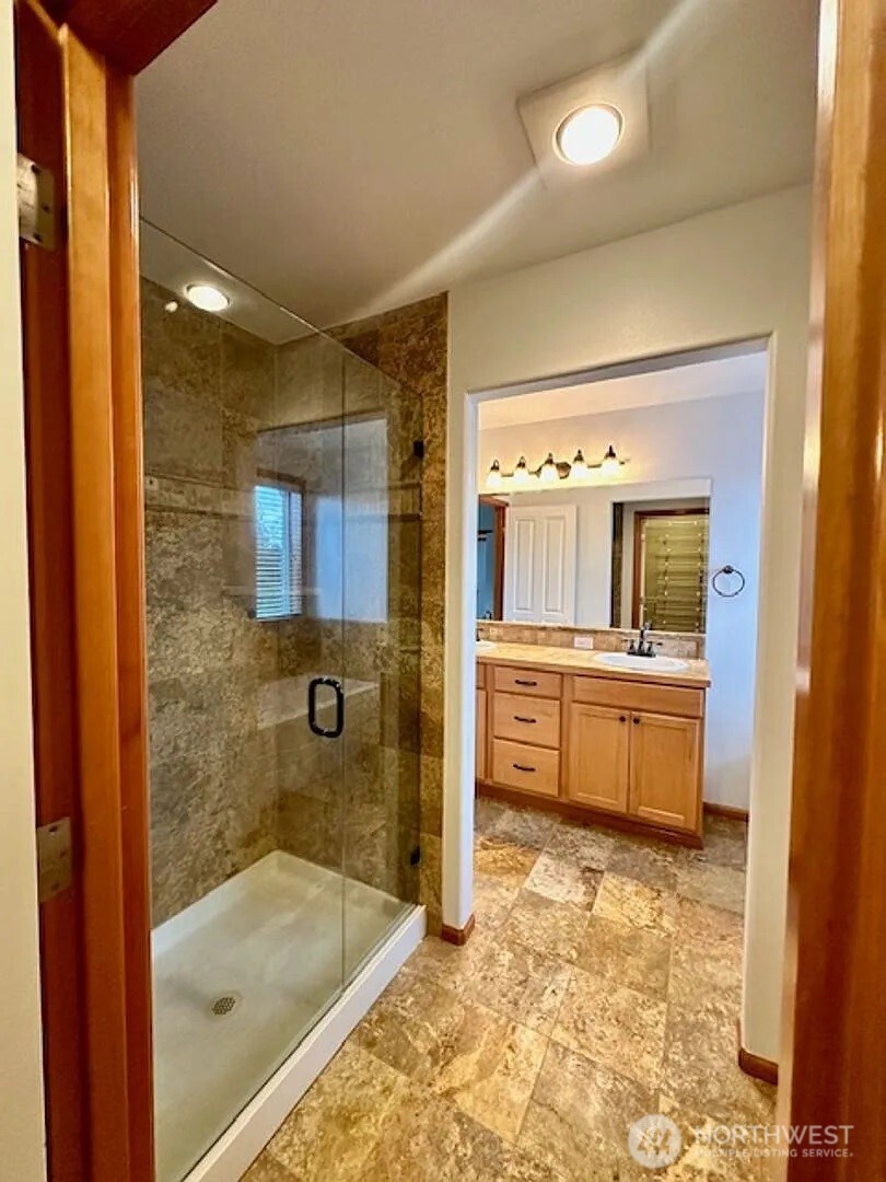 2013 Northeast 27th Street Renton, WA 98056 - Photo 22 of 25 a bathroom with a tub sink and mirror