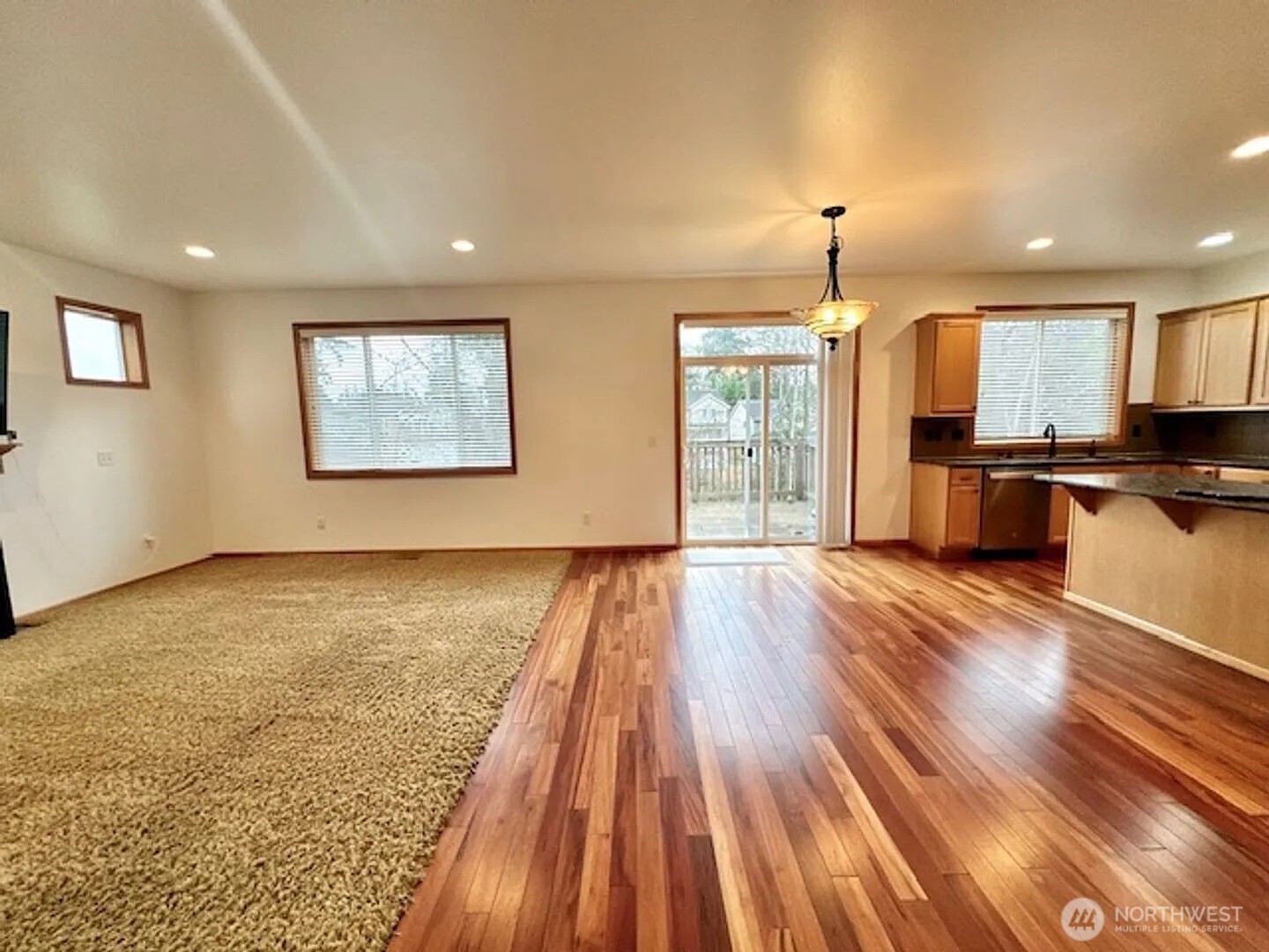 2013 Northeast 27th Street Renton, WA 98056 - Photo 5 of 25 a view of a kitchen with a stove cabinets and wooden floor