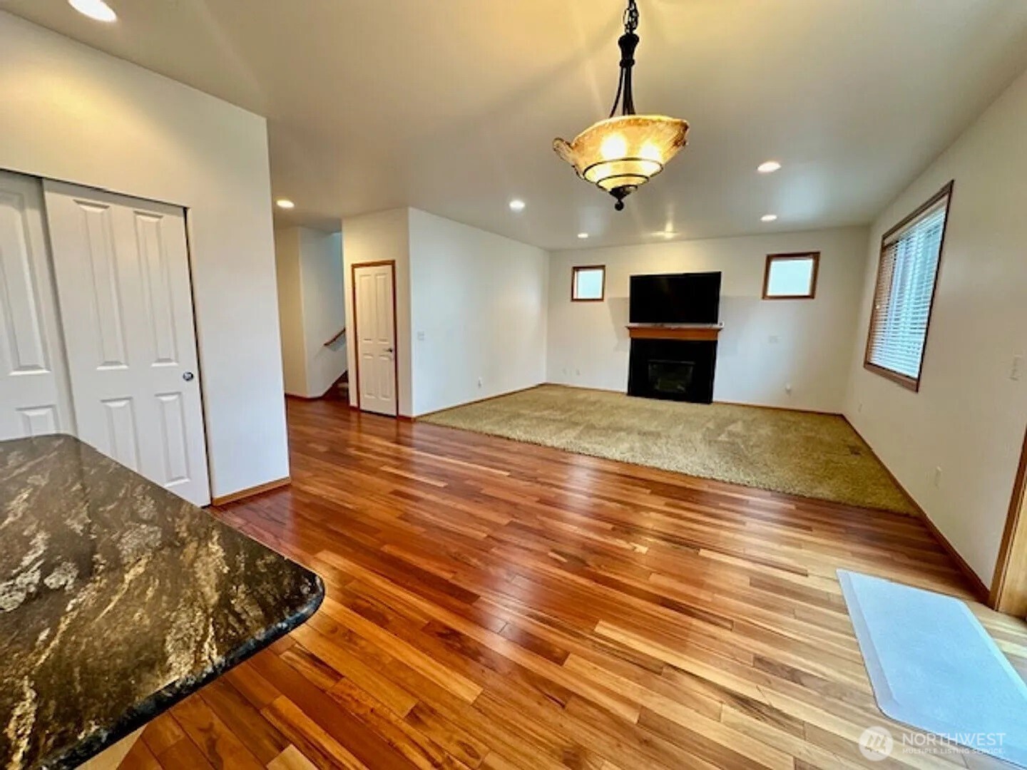 2013 Northeast 27th Street Renton, WA 98056 - Photo 6 of 25 a view of a livingroom with a furniture wooden floor and a ceiling fan