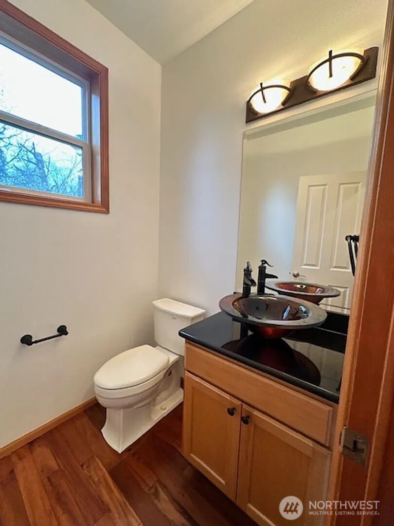 2013 Northeast 27th Street Renton, WA 98056 - Photo 8 of 25 a bathroom with a sink and a mirror