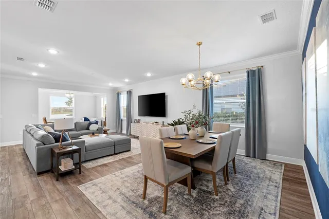 a view of a dining room with furniture window and outside view