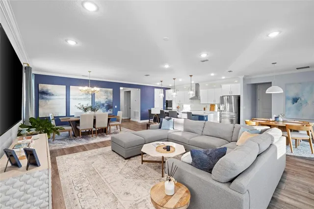 a spacious bedroom with a bed and a flat screen tv