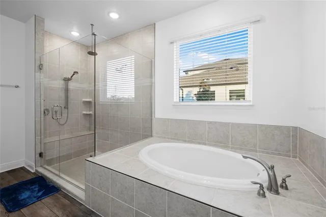 a spacious bathroom with a sink and a mirror