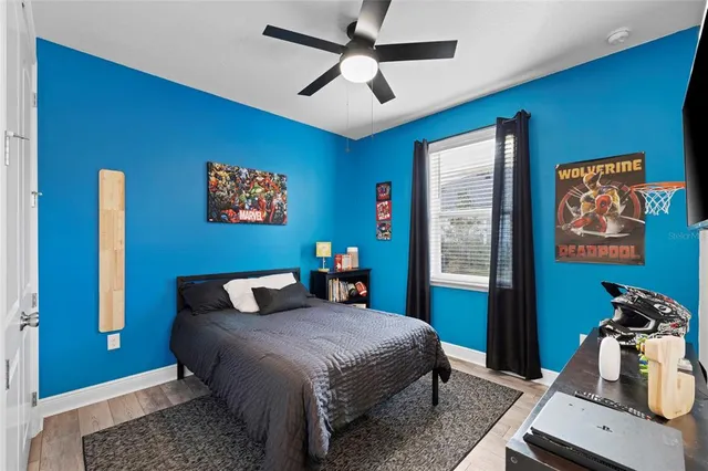 a bedroom with a bed and a book shelf