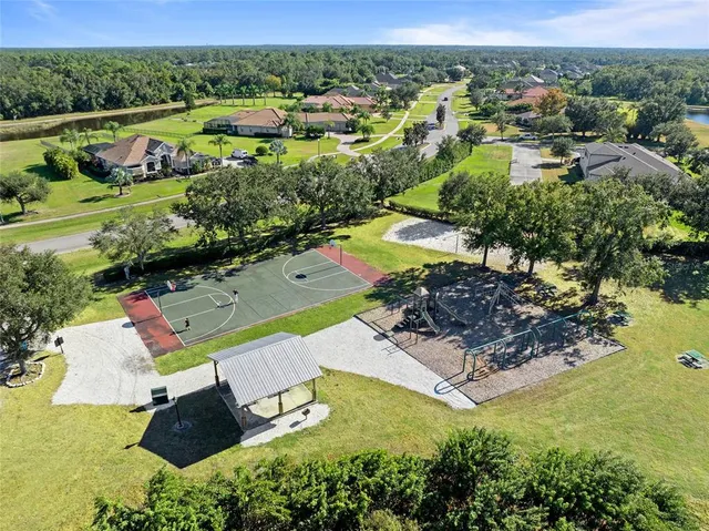 an aerial view of a houses with a lake view