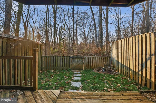 a view of a backyard with pathway