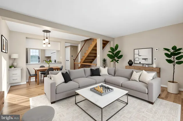 a living room with furniture rug and window