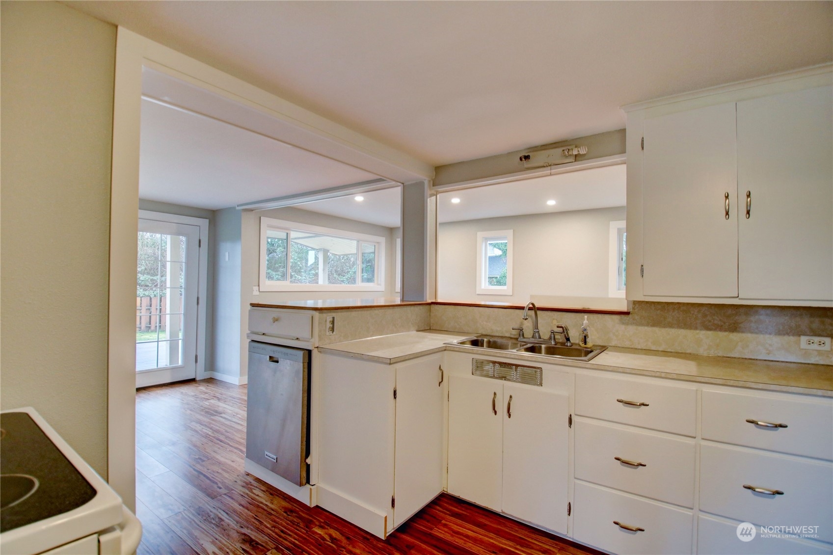 16614 Dunbar Road Mount Vernon, WA 98273 - Photo 12 of 40 a kitchen with a sink cabinets and wooden floor