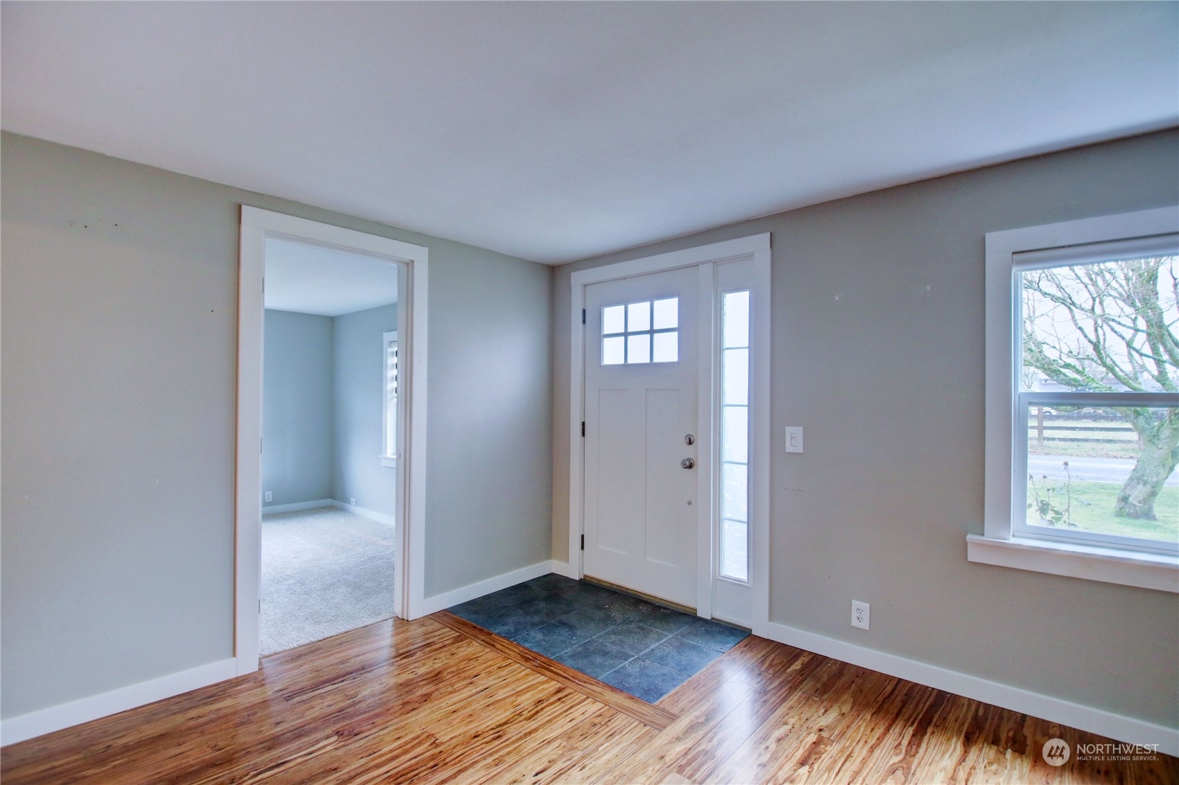 16614 Dunbar Road Mount Vernon, WA 98273 - Photo 5 of 40 a view of an empty room with window and wooden floor