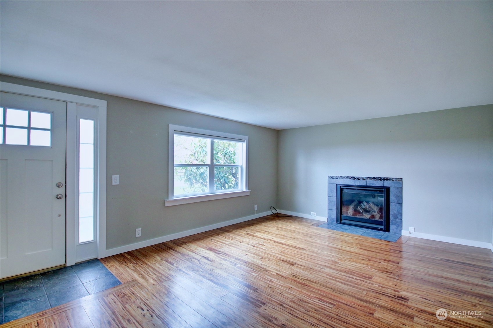 16614 Dunbar Road Mount Vernon, WA 98273 - Photo 7 of 40 an empty room with wooden floor and windows