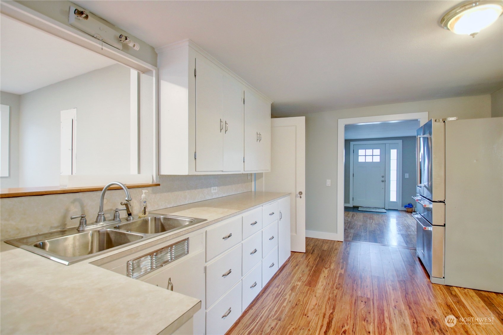 16614 Dunbar Road Mount Vernon, WA 98273 - Photo 9 of 40 a kitchen with a sink and cabinets