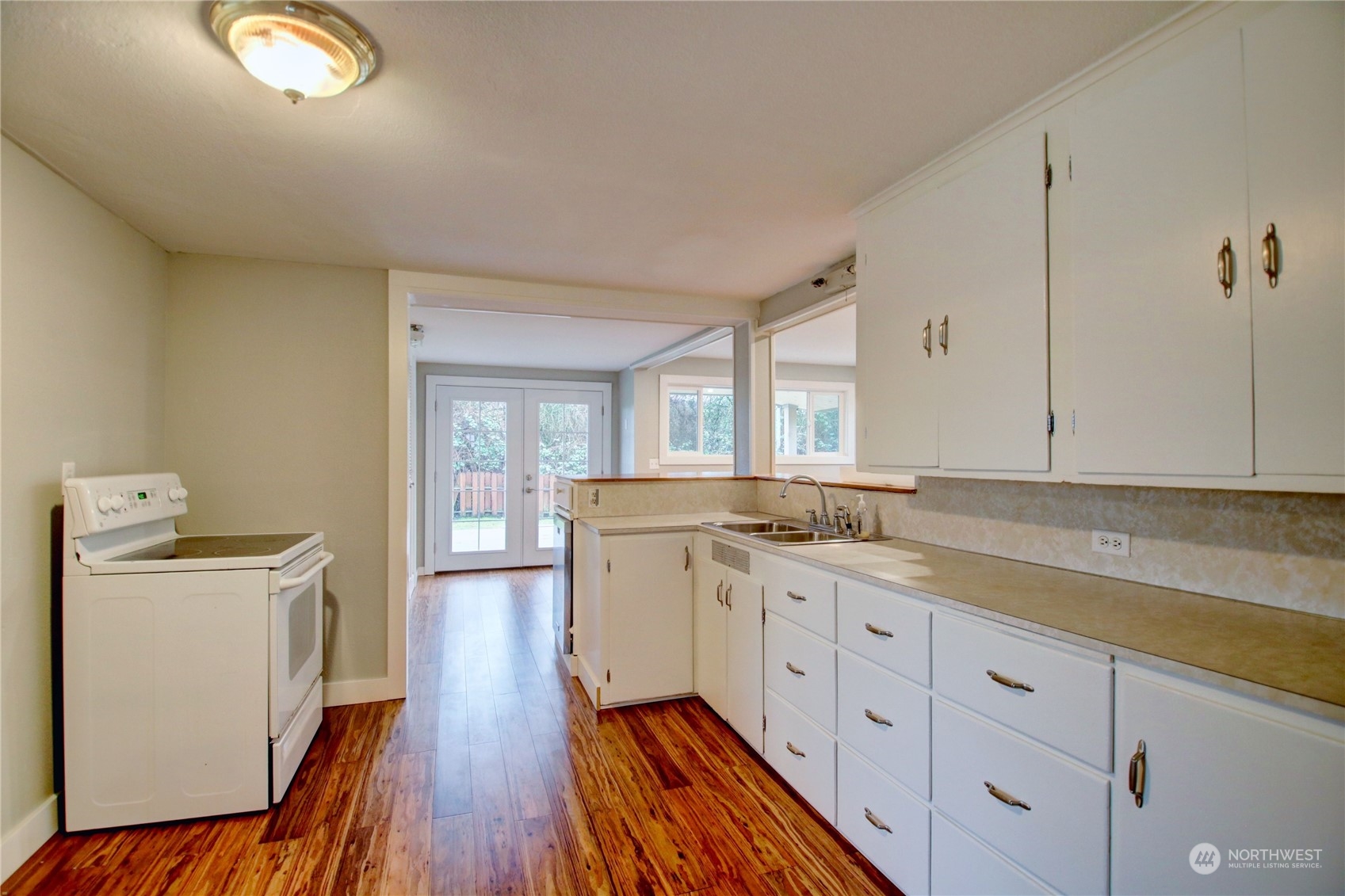 16614 Dunbar Road Mount Vernon, WA 98273 - Photo 10 of 40 a kitchen with a sink stove and cabinets