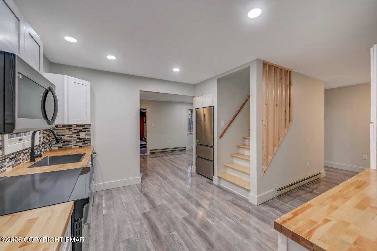 384 Devils Hole Road Cresco, PA 18326 - Photo 19 of 55 a view of hallway with wooden floor and stairs